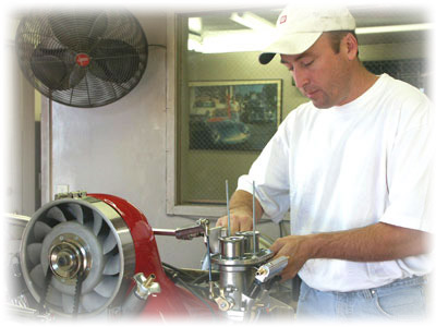 Patricks Downs tunes up a CB Turnkey Engine, in the Dyno Room