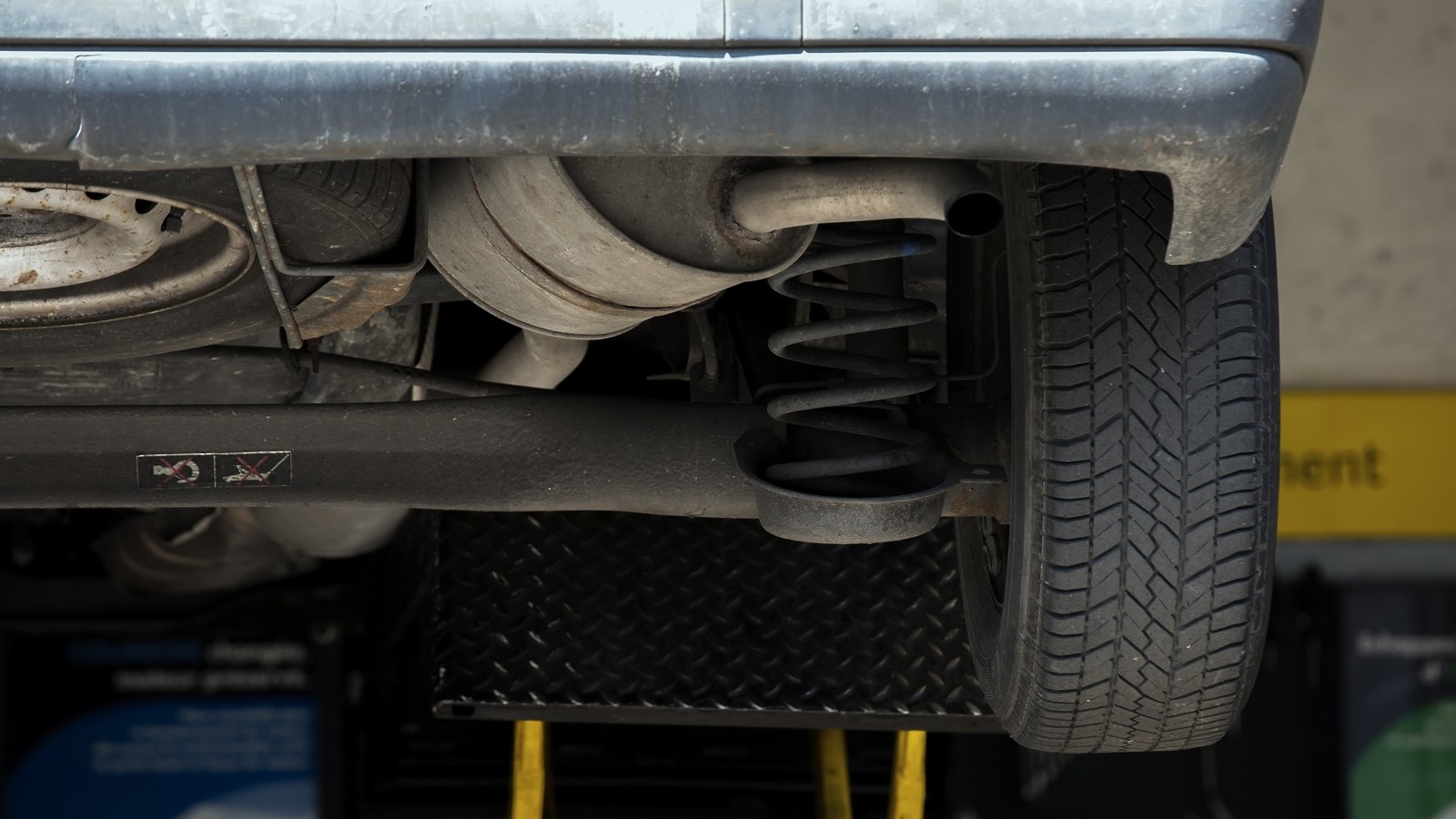 Close Up of shock absorbers replacement in a garage