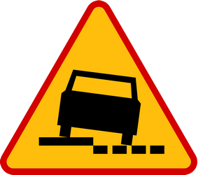 Traffic sign of Poland: Warning for a soft verge